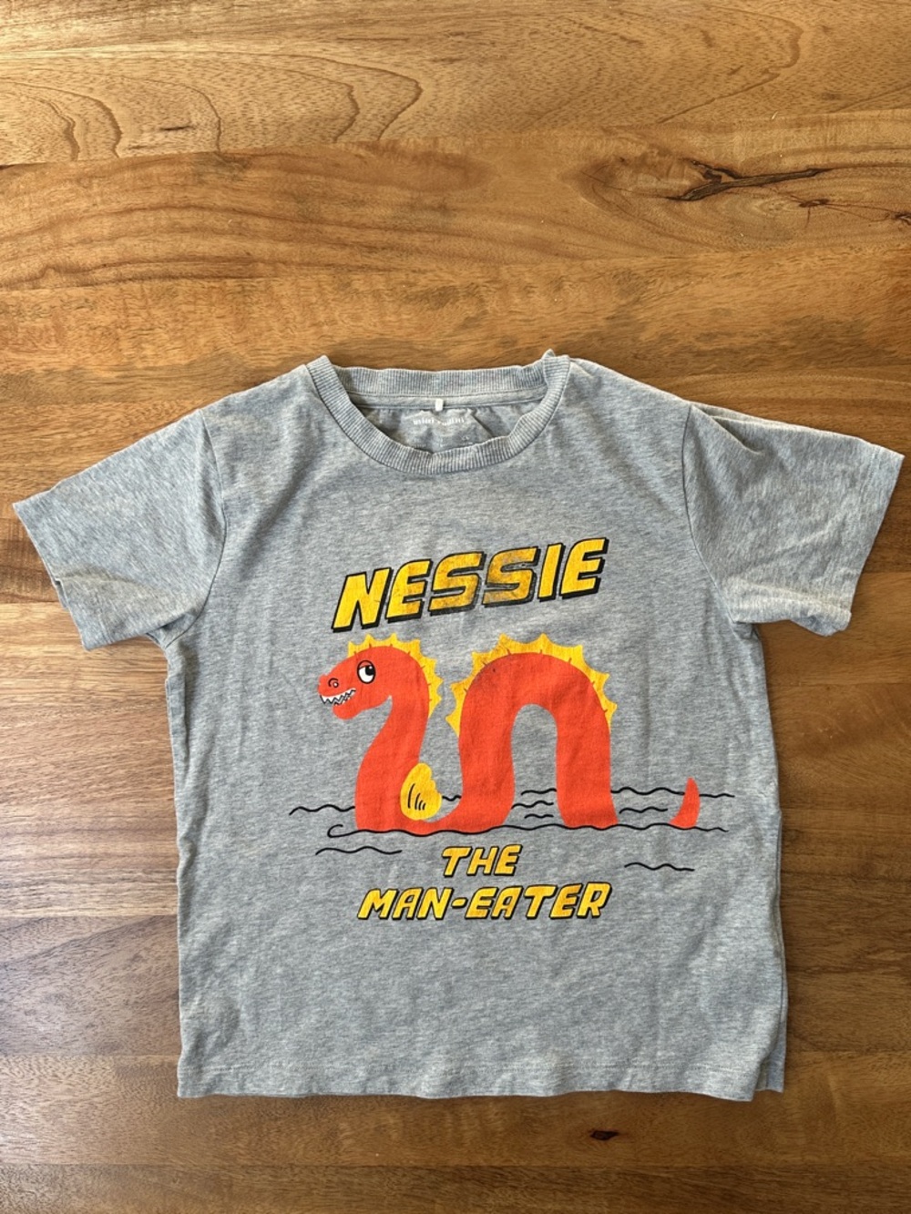 Mini Rodini Grey Tee with Orange & Yellow Nessie “The Man Eater” Graphic
